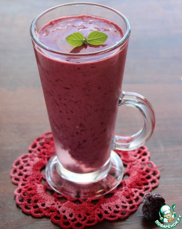 A creamy cocktail with blackberries