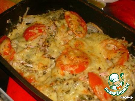 Red fish baked with tomato and cheese