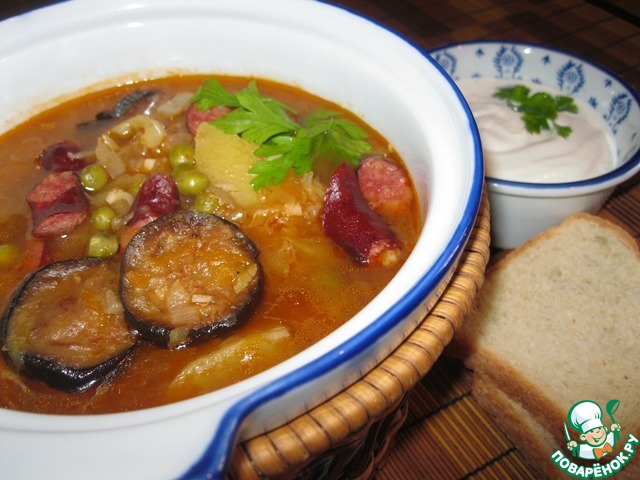 Soup with sausage, eggplant and peas