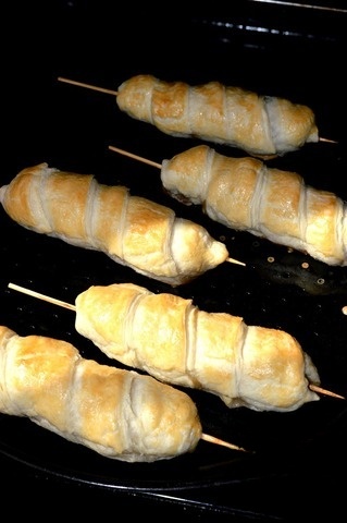 Appetizer with mushrooms and cheese on skewers