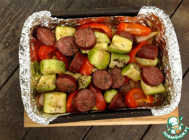 Krakow sausage with vegetables in foil