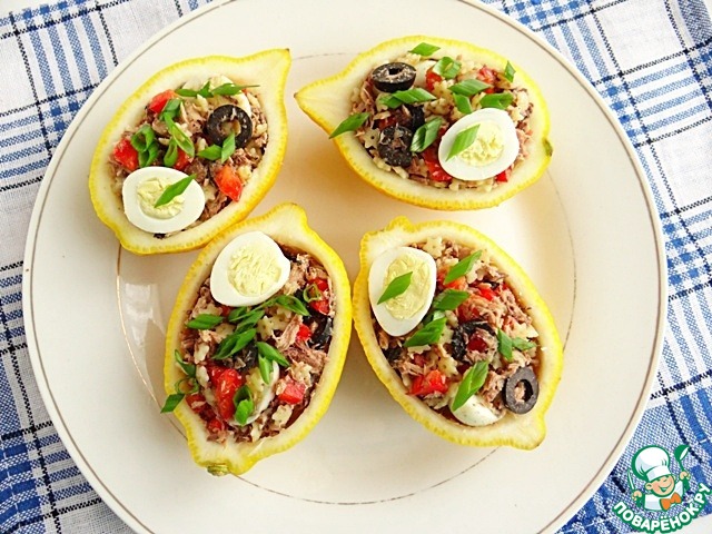 Fish salad in lemon cups