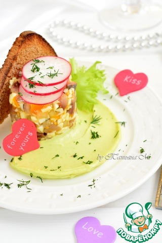 Appetizer of herring with cream of avocado