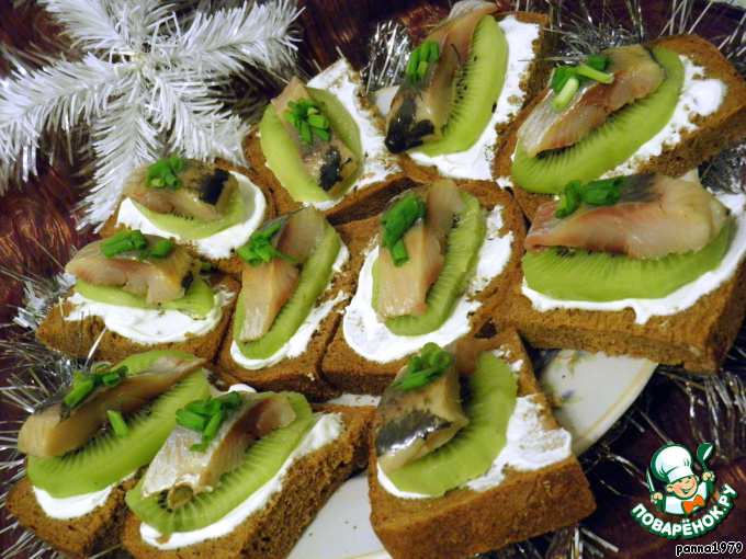Canape with herring and kiwi
