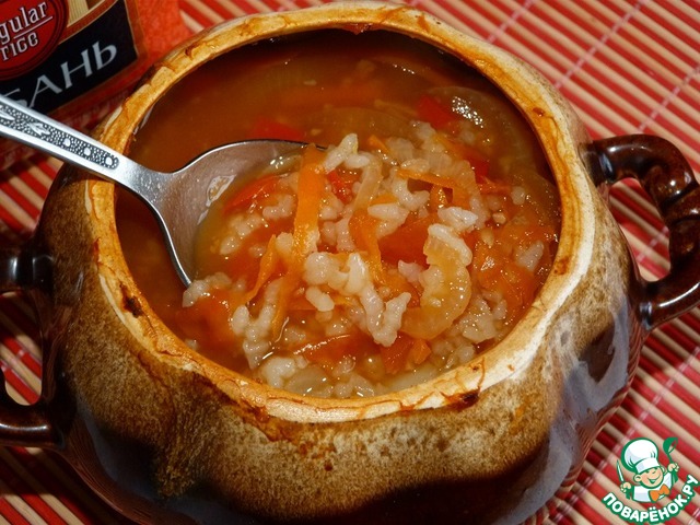 Soup of vegetables with rice in a pot