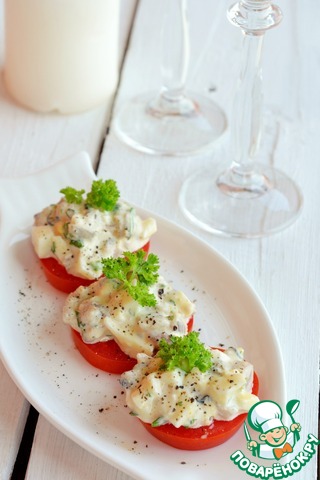 Appetizer of capelin on tomato slices