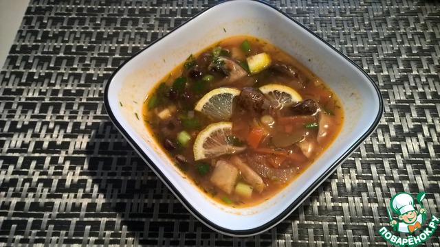 Solyanka chicken broth with mushrooms