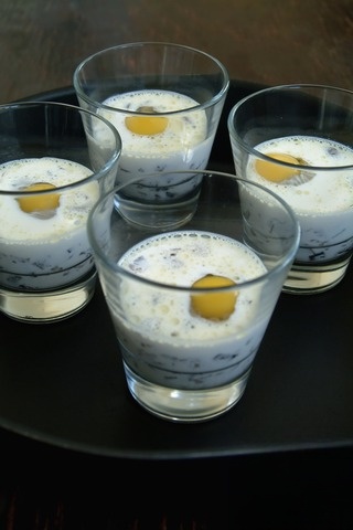 Appetizer of mushrooms in a creamy sauce with quail eggs
