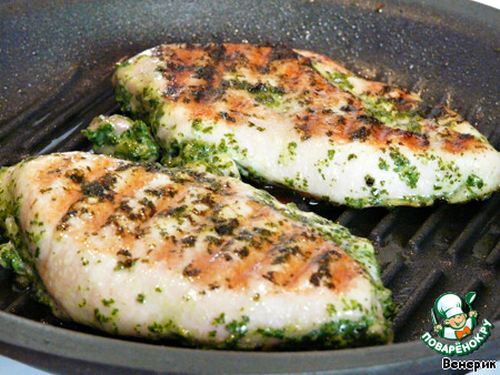 Chicken breast in a green marinade