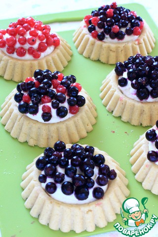 Baskets of berries and sweet cream