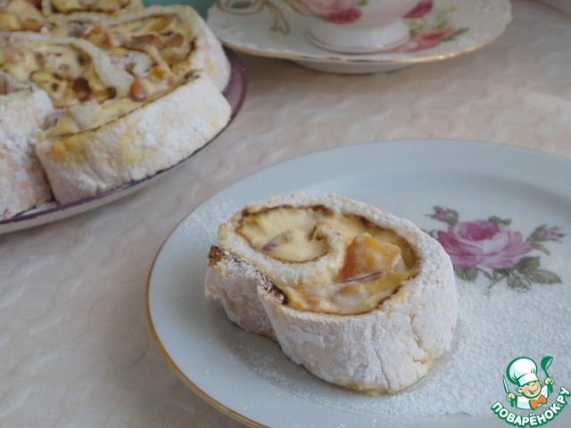 Meringue roulade with cottage cheese cream and peaches