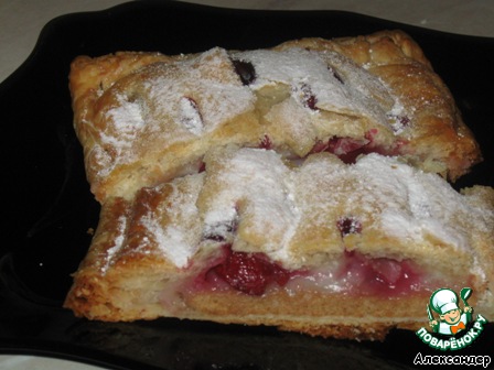 Strudel puff pastry with cherries and pudding