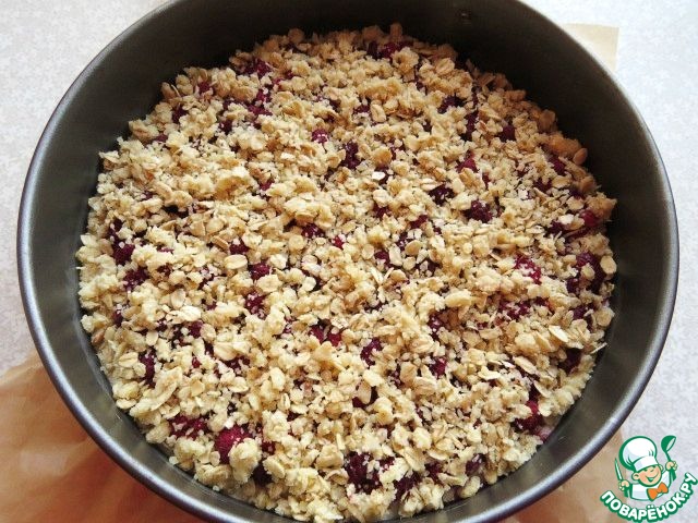 A cake of oatmeal with raspberries