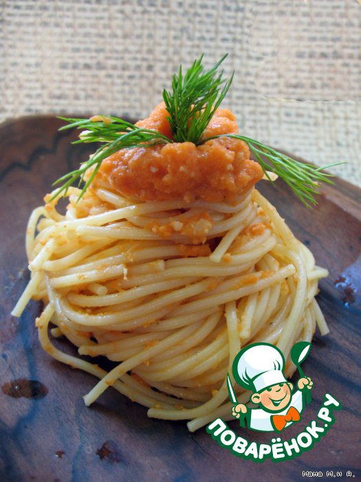 Spaghetti under the carrot-peanut sauce