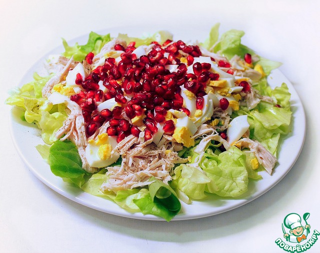 Light salad with chicken, egg and pomegranate seeds