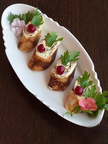 Pancake rolls stuffed with mushrooms and cheese