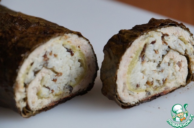 Roll of minced meat with rice and grape leaves