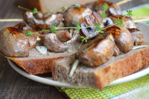 Mushrooms grilled on skewers
