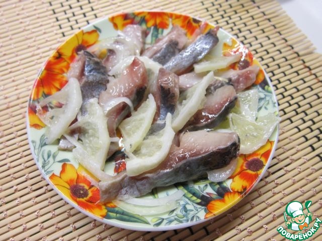 Salted herring with onion and lemon