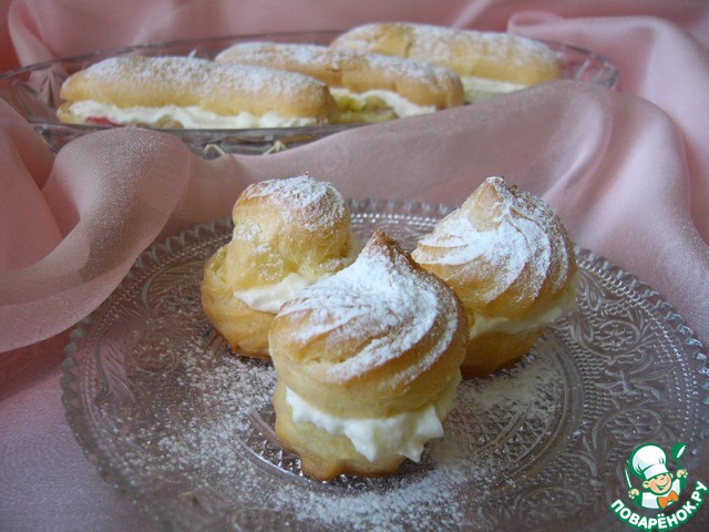 Profiteroles and eclairs with jelly and cream