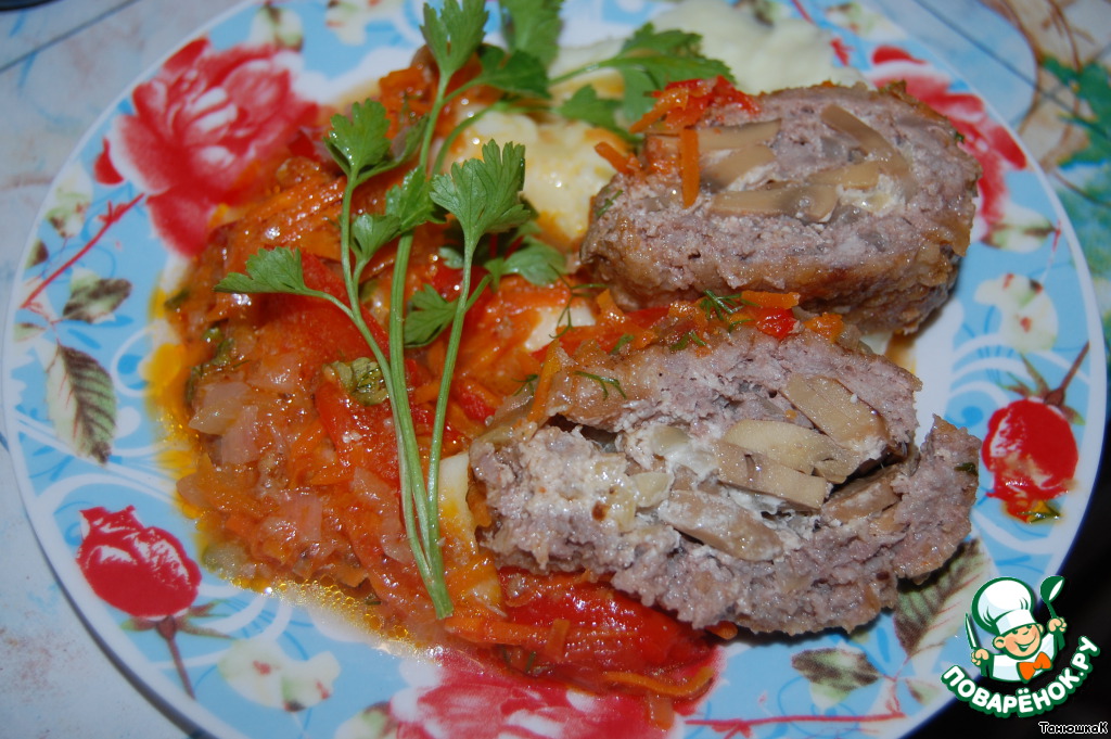 Meatloaf with mushrooms in a vegetable sauce