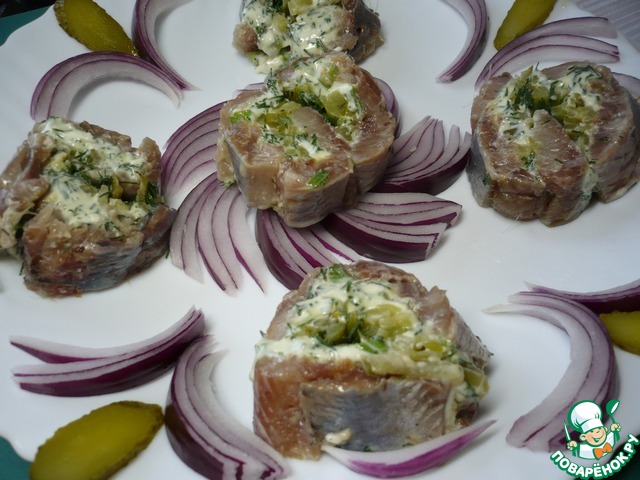 Appetizer of herring with pickled cucumbers