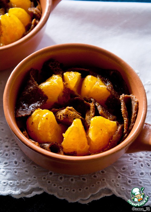 Baked pancakes with chocolate and tangerines