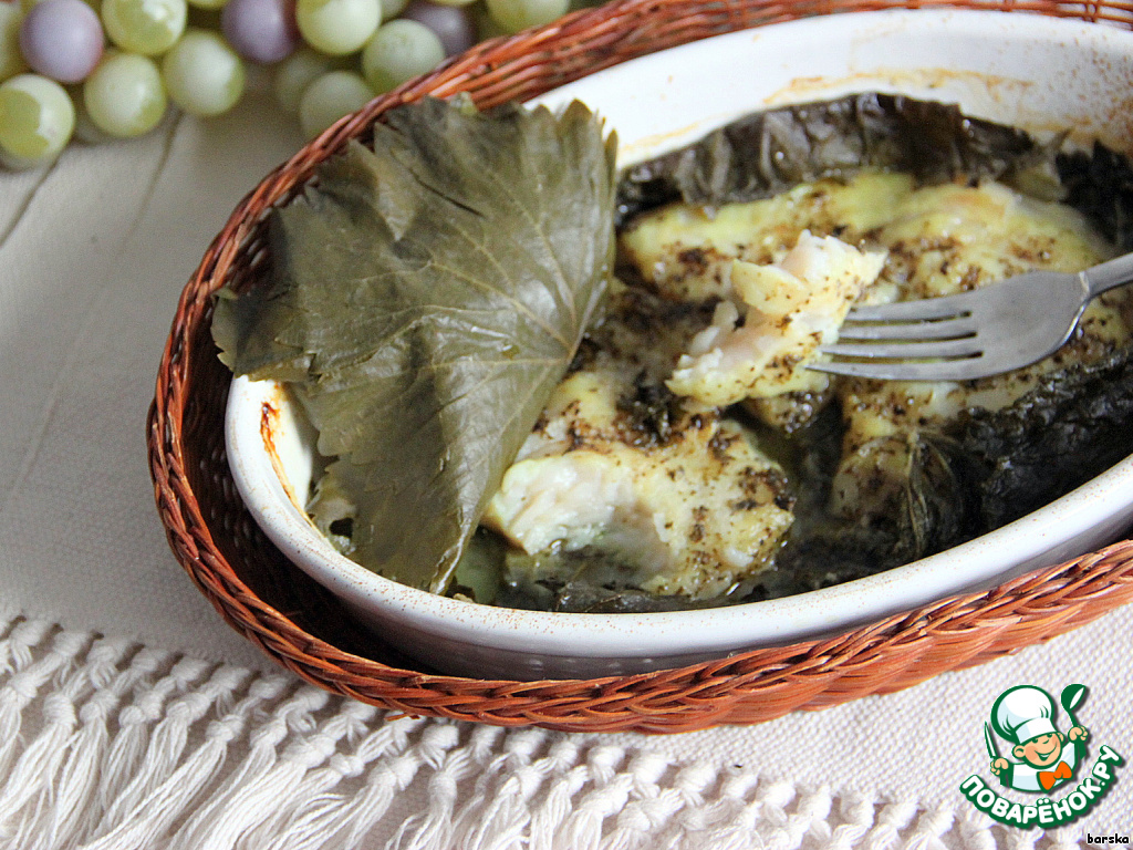 Fish fillets baked in grape leaves