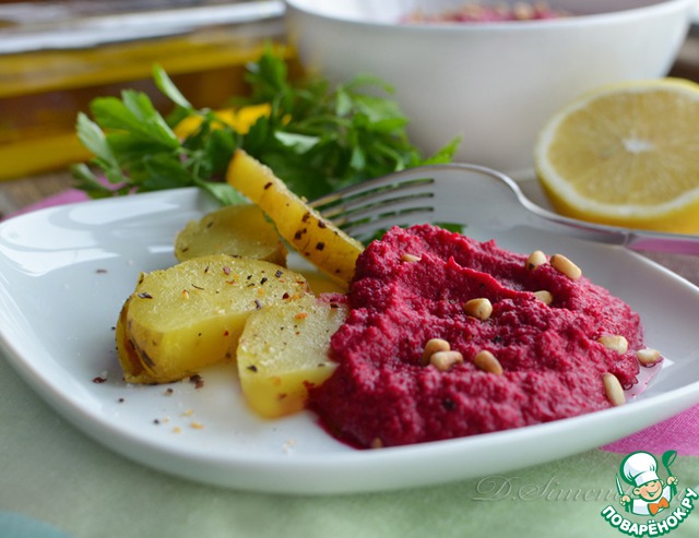 Beetroot and chickpeas hummus with roasted garlic and pine nuts