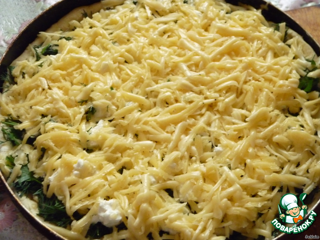 Pie with herbs and cheese of two varieties