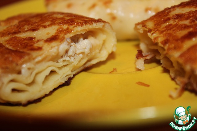 Delicious pancakes with chicken and cheese