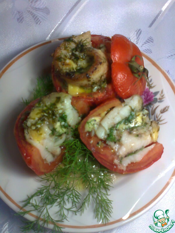 Fish baked in tomatoes