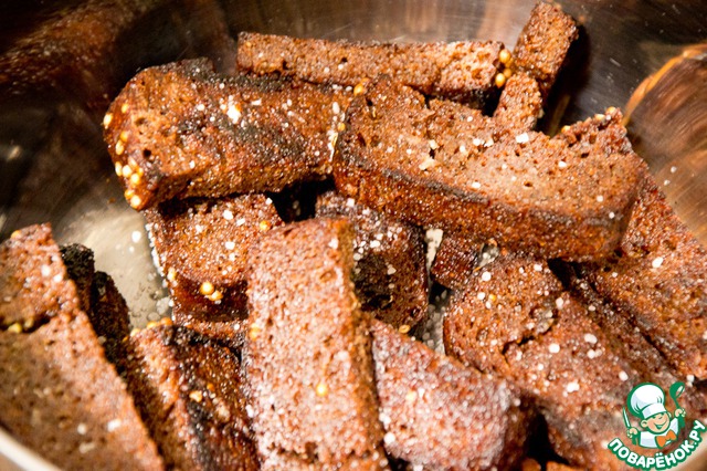 Buckwheat in a pot with garlic croutons