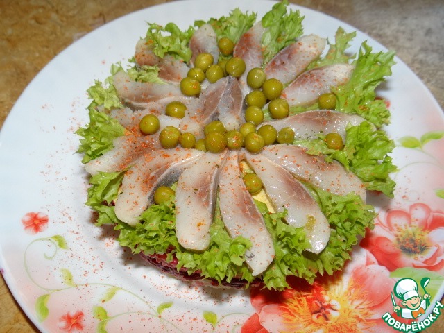 Layered salad with herring, vegetables and rice