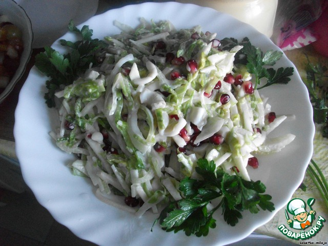 Salad with squid and pomegranate seeds