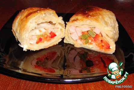 Stuffed sausages and vegetables in puff pastry