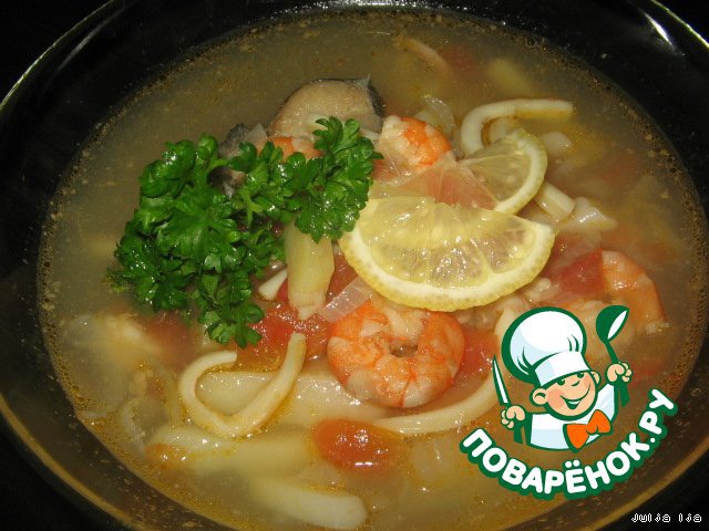 Soup with tomatoes, trout and seafood