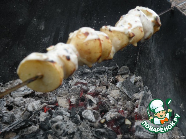 Vegetables and potatoes in sauce on fire