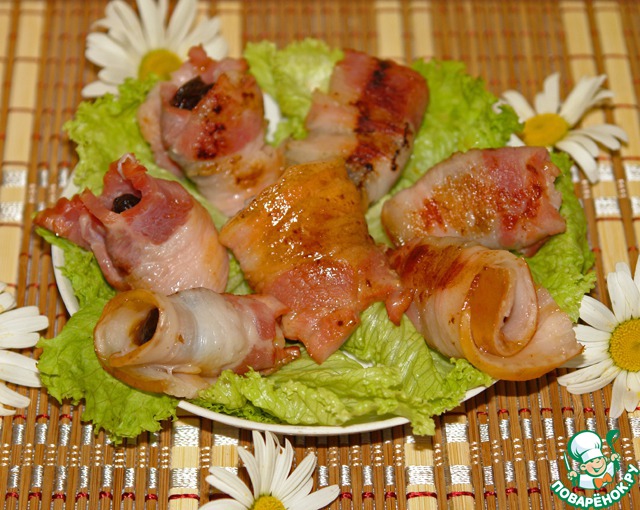 The rolls prunes wrapped in bacon