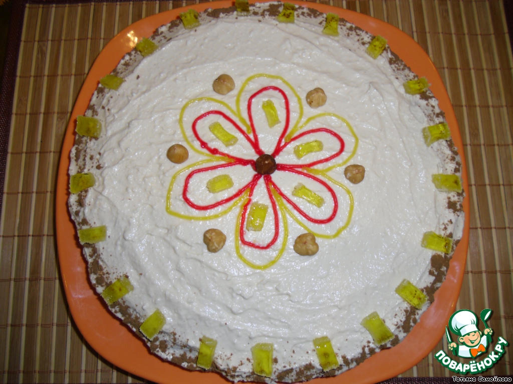 Carrot cake with cottage cheese cream and hazelnuts