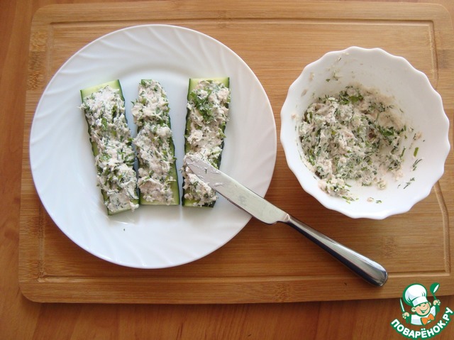 Sandwiches with fish on cucumber