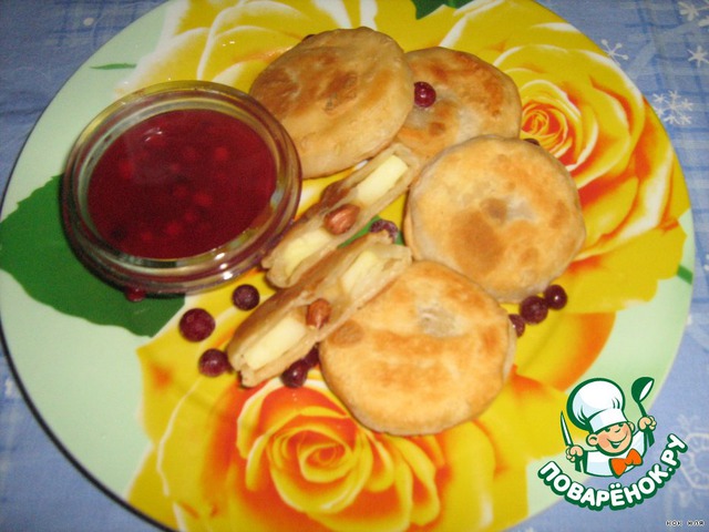 Apple baked in pastry with cranberry sauce