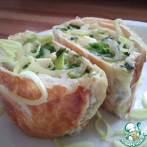 Roll c green onions, eggs and cheese