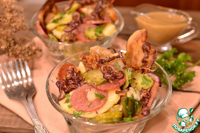 Hearty salad with bacon and pickled cucumbers