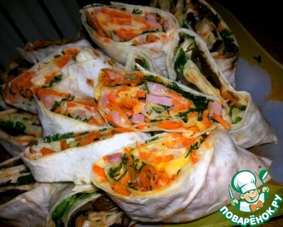 Rolls of pita with ham and carrots