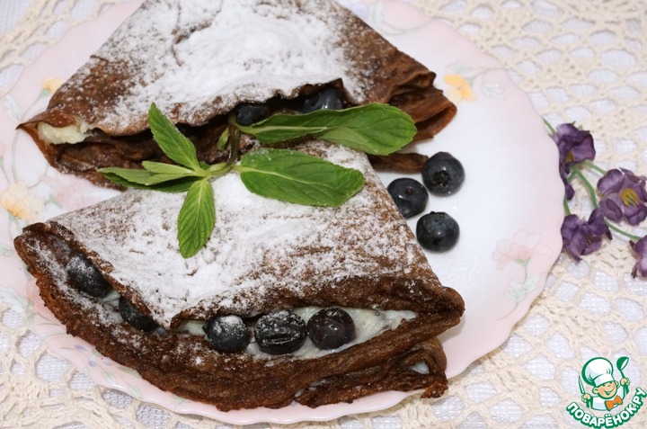 Cherry pancakes with vanilla cream and blueberries