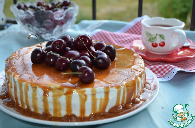 Cake with caramel frosting and a cherry