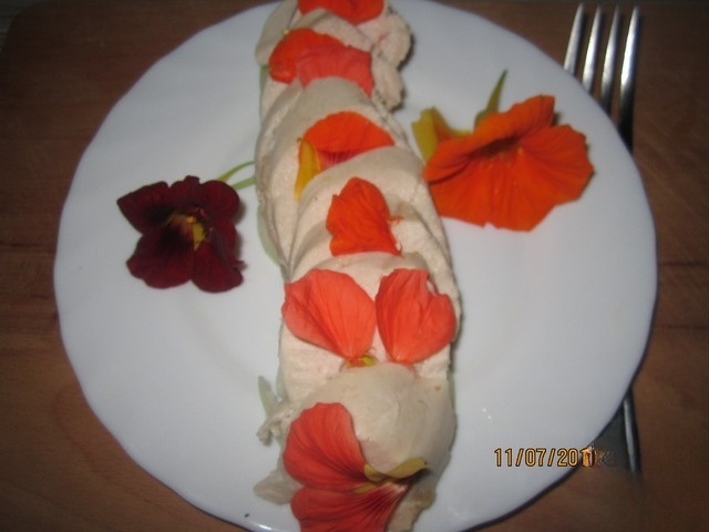 Breast of bird with nasturtium