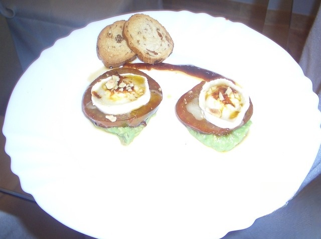 Towers of tomatoes in the marinade with goat cheese