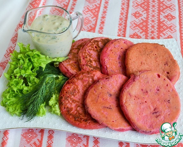 Beet pancakes with herring sauce